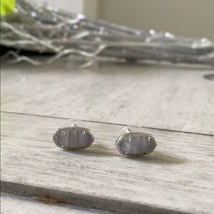 Kendra Scott silver earrings.